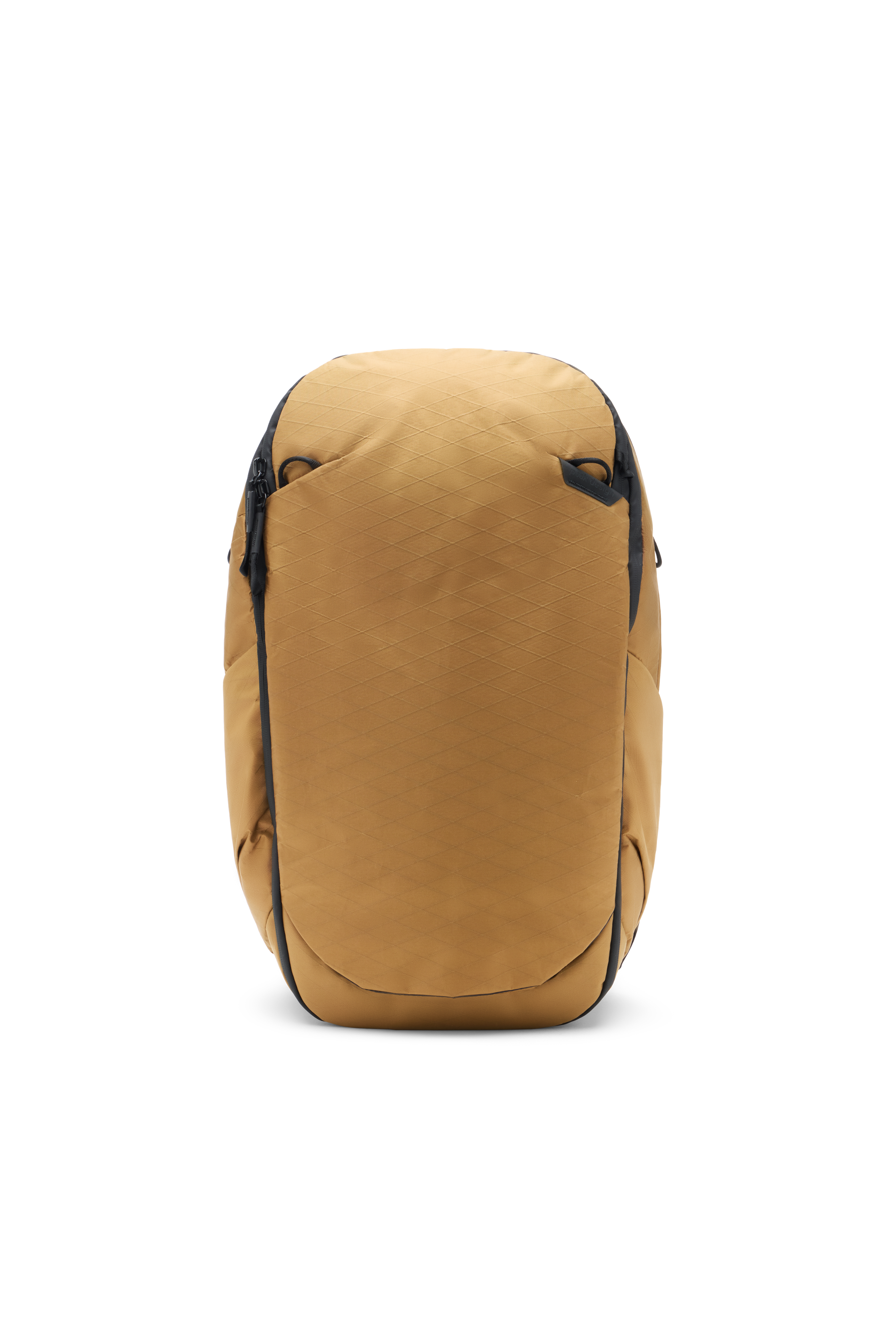Peak Design 30L Travel Backpack being examined on a wooden desk